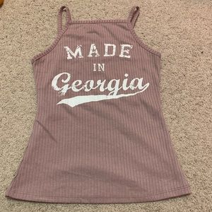 Tight fitting sleeveless shirt.